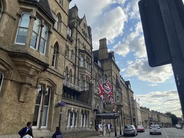 The Randolph Hotel by Graduate Hotels in Oxford, UK. Located on Beaumont Street by the corner of Magdalen Street, opposite the Ashmolean Museum. Three Union Jacks hang above the main entrance