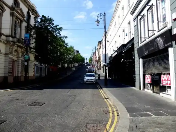 Shipquay Street, Derry, in an earlier year; nearby street setting, not a hotel interior or room view