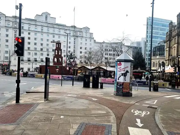 Christmas market chalets in Leeds City Square inDecember 2024