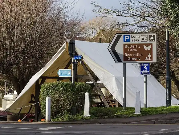 Historic Swan’s Nest Lane riverside setting near the hotel, with a timber building and local direction signs