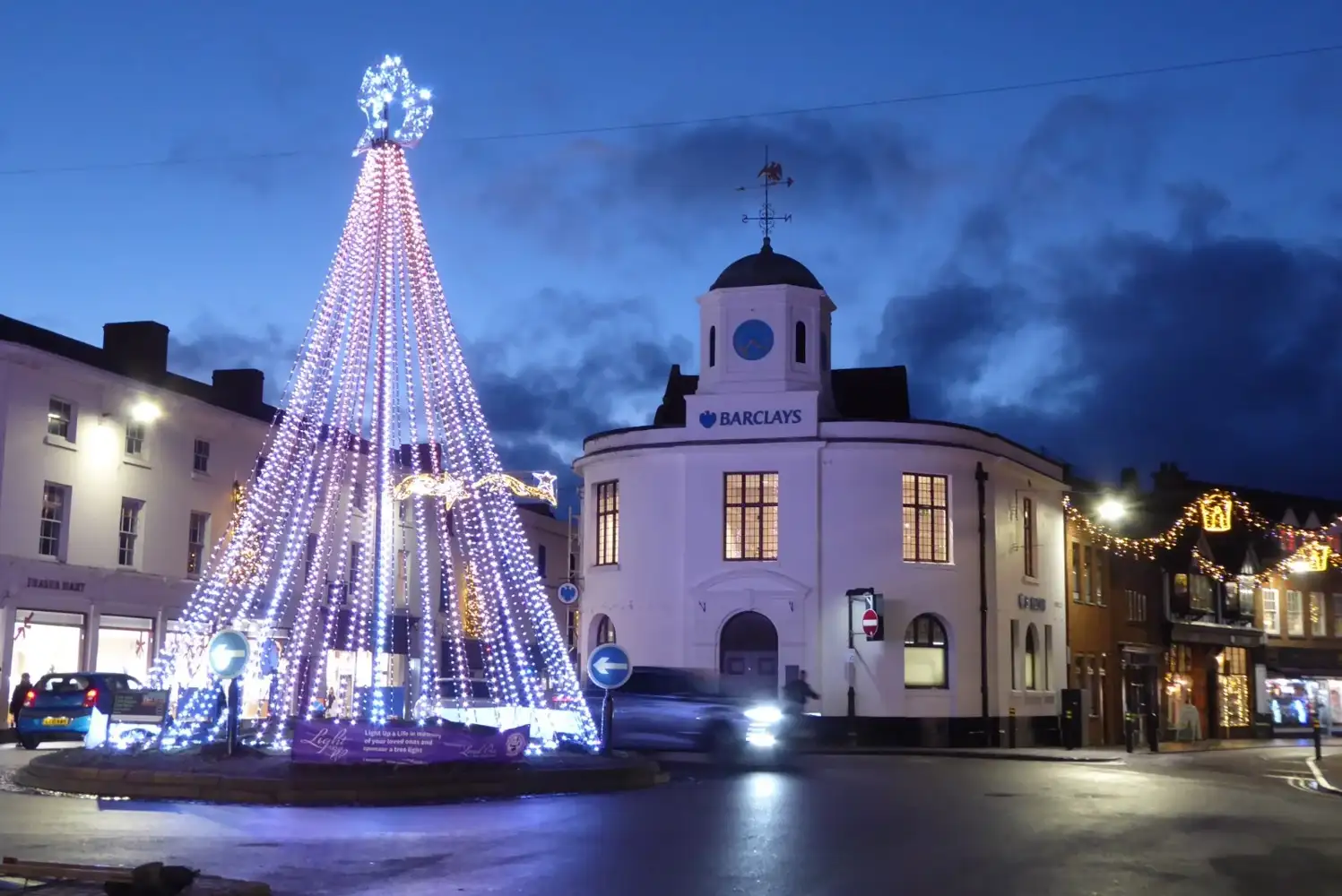 Christmas lights and illuminated tree on Bridge Street in Stratford-upon-Avon, photographed in a previous season