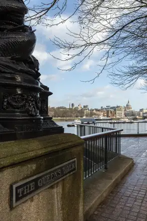 Nearby: The Queen’s Walk nameplate, riverside railings and the Thames on London’s South Bank